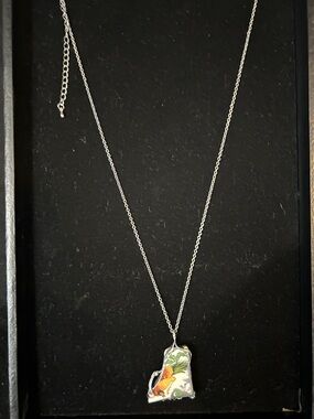 Silver Fish Pendant Necklace with Green and Orange Accent